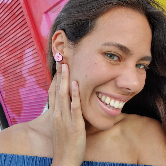 Girl wearing Feminist Candy Heart Studs