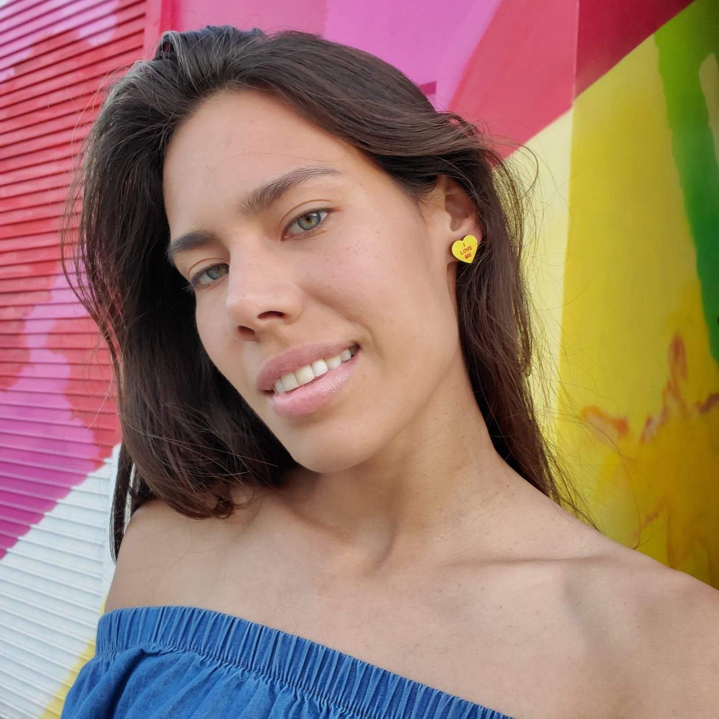 Girl wearing Feminist Candy Heart Studs