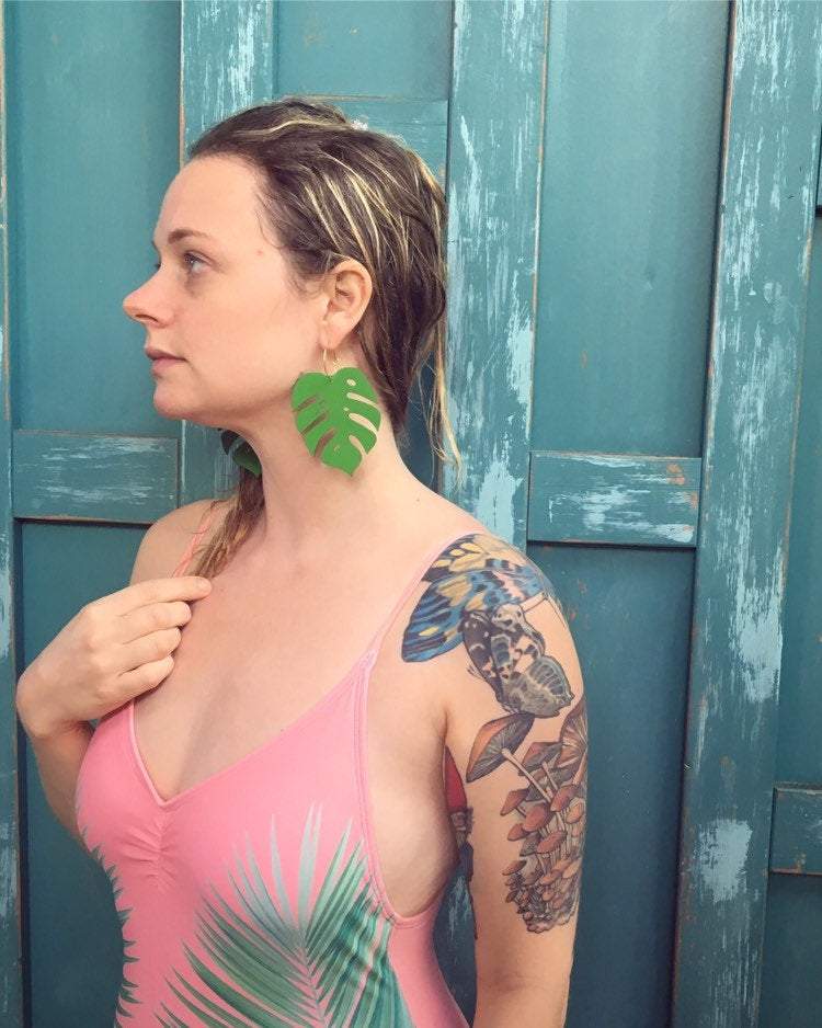 Girl wearing Giant Green Monstera Leaf Hoops