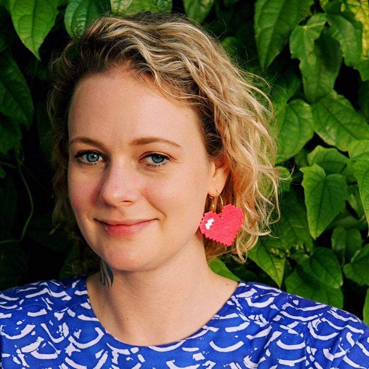 Girl wearing Pixelated Heart Hoop Earrings