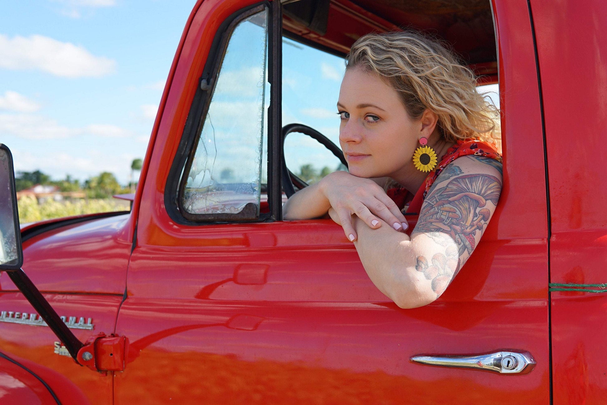 Girl wearing Sunflower Dangle Earrings