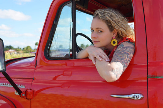 Girl wearing Sunflower Dangle Earrings
