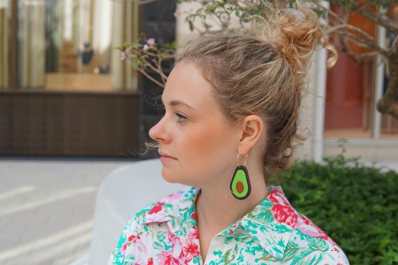 Girl Wearing Avocado Hoop Earrings