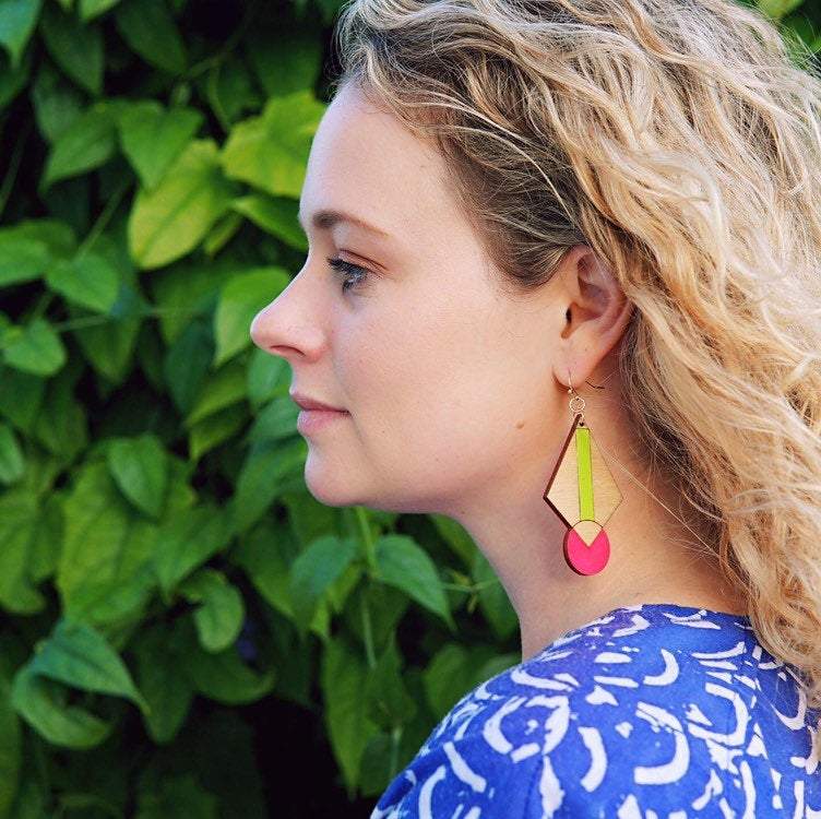 Girl Wearing Neon Art Deco Earrings