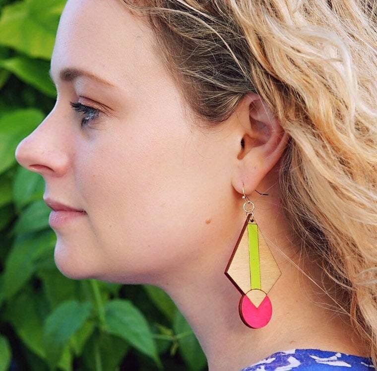 Girl Wearing Neon Art Deco Earrings