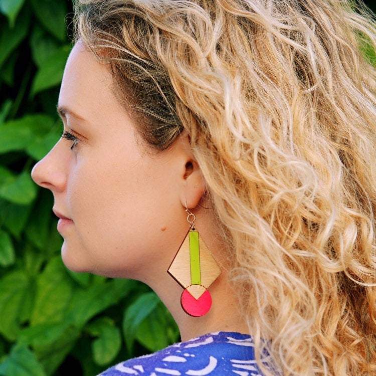 Girl Wearing Neon Art Deco Earrings