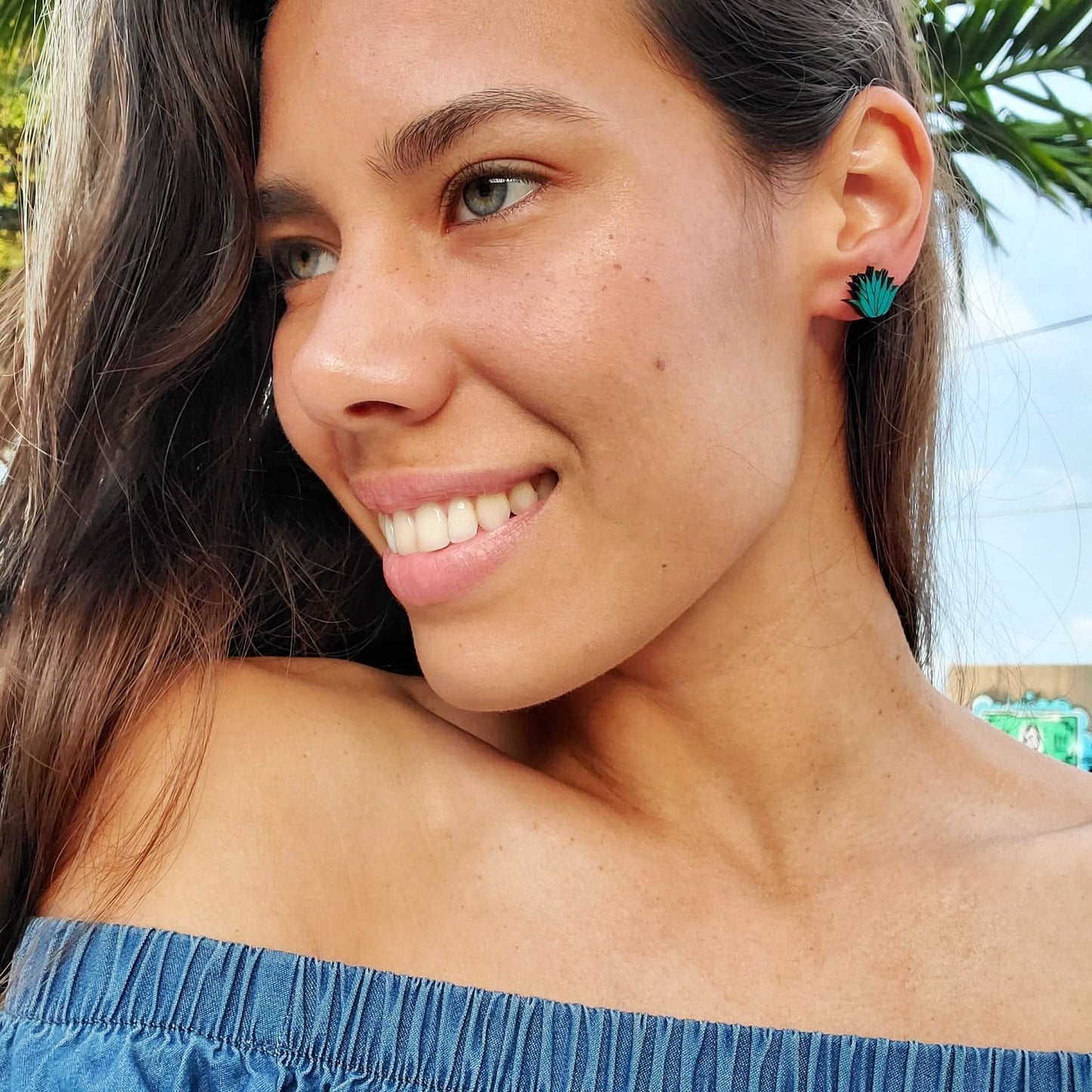 Girl Smiling looking away, wearing Agave Earrings