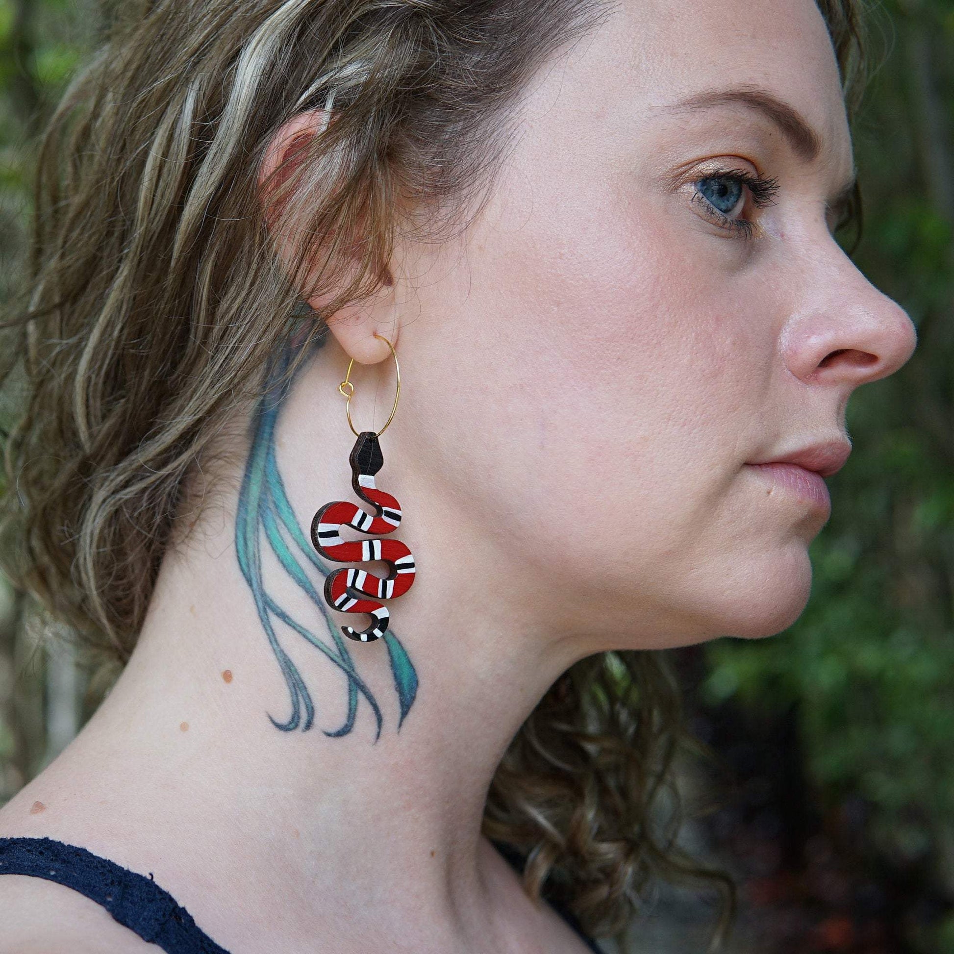 Girl wearing Red Snake Hoop Earrings