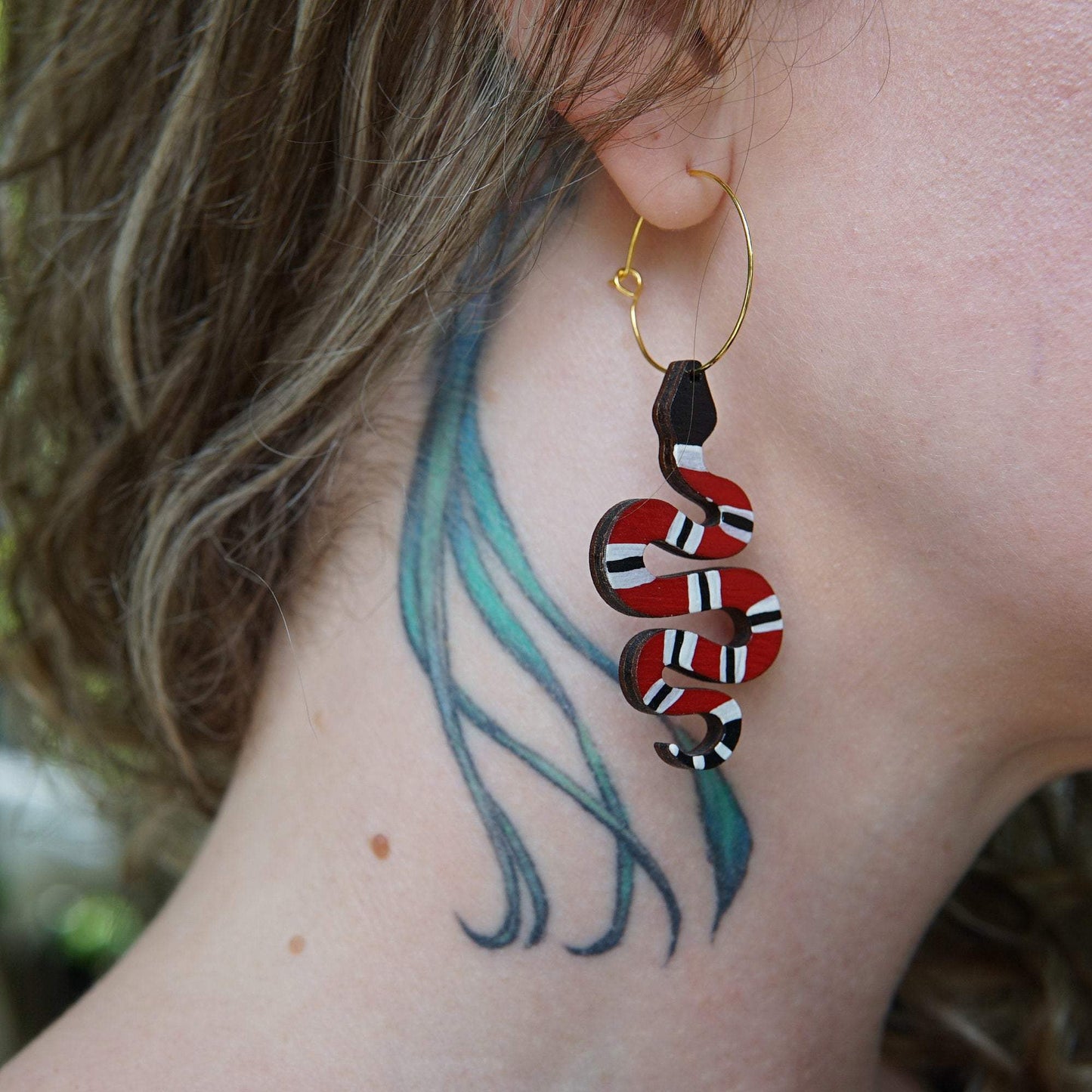 Girl wearing Red Snake Hoop Earrings